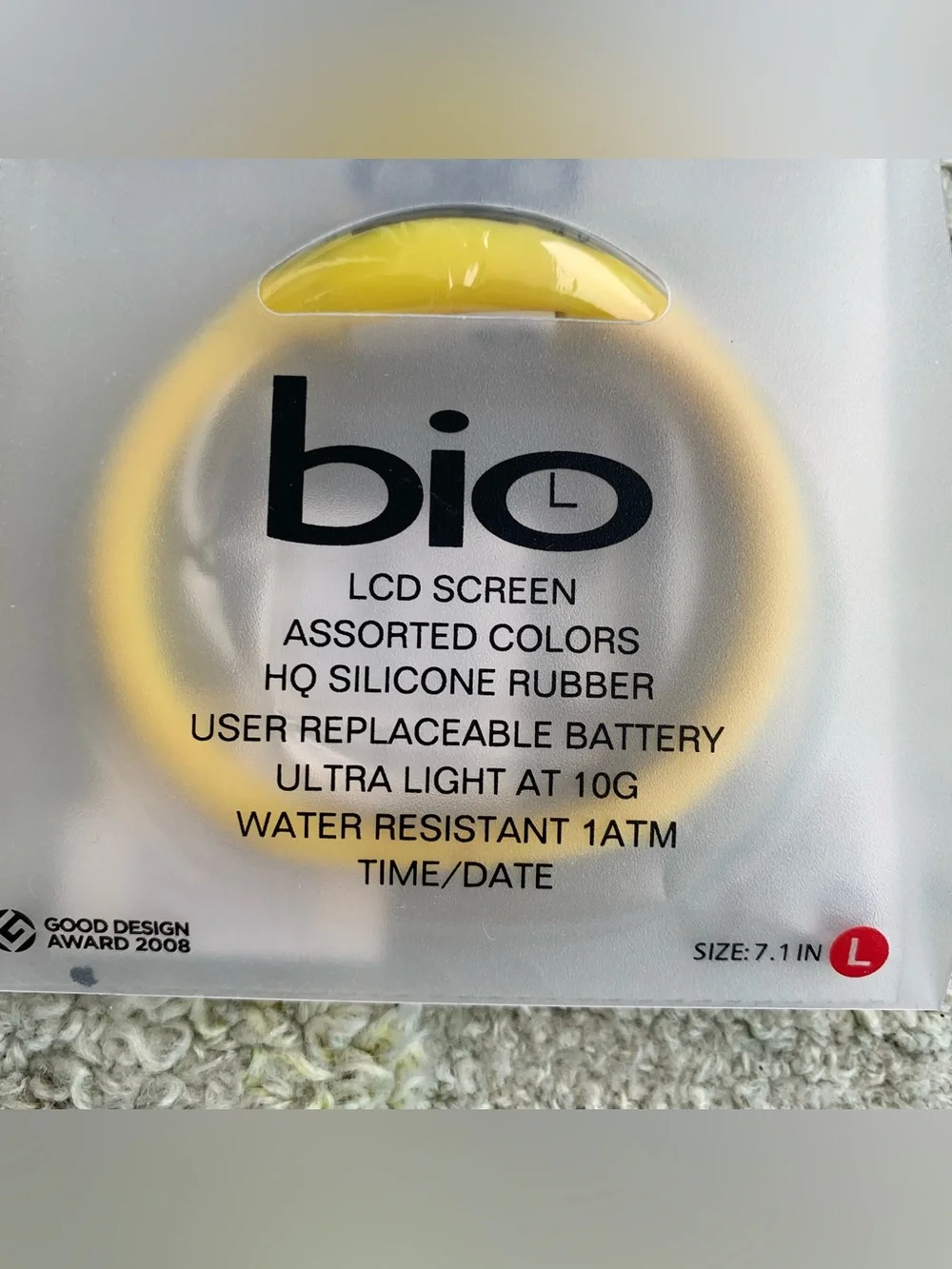 yellow Bio digital sports watch inside its translucent packaging